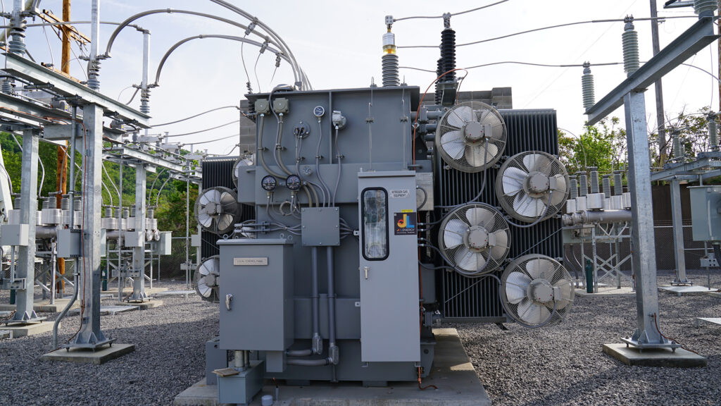 Close-up of electrical substation transformers optimizing power distribution